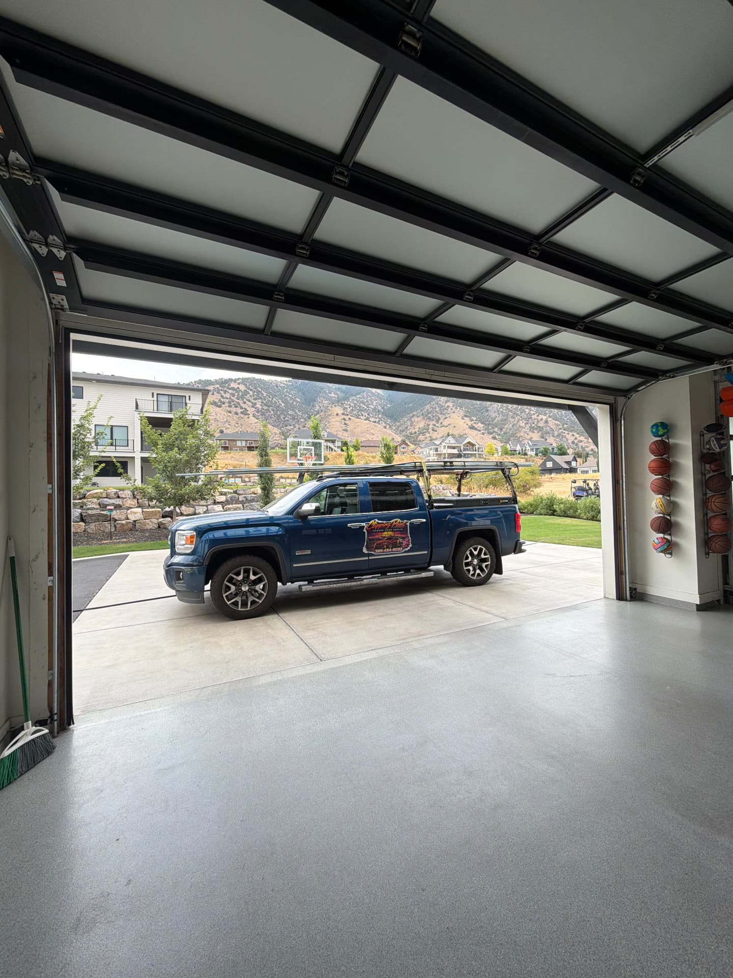 Clipping Point service truck framed by a freshly installed garage door